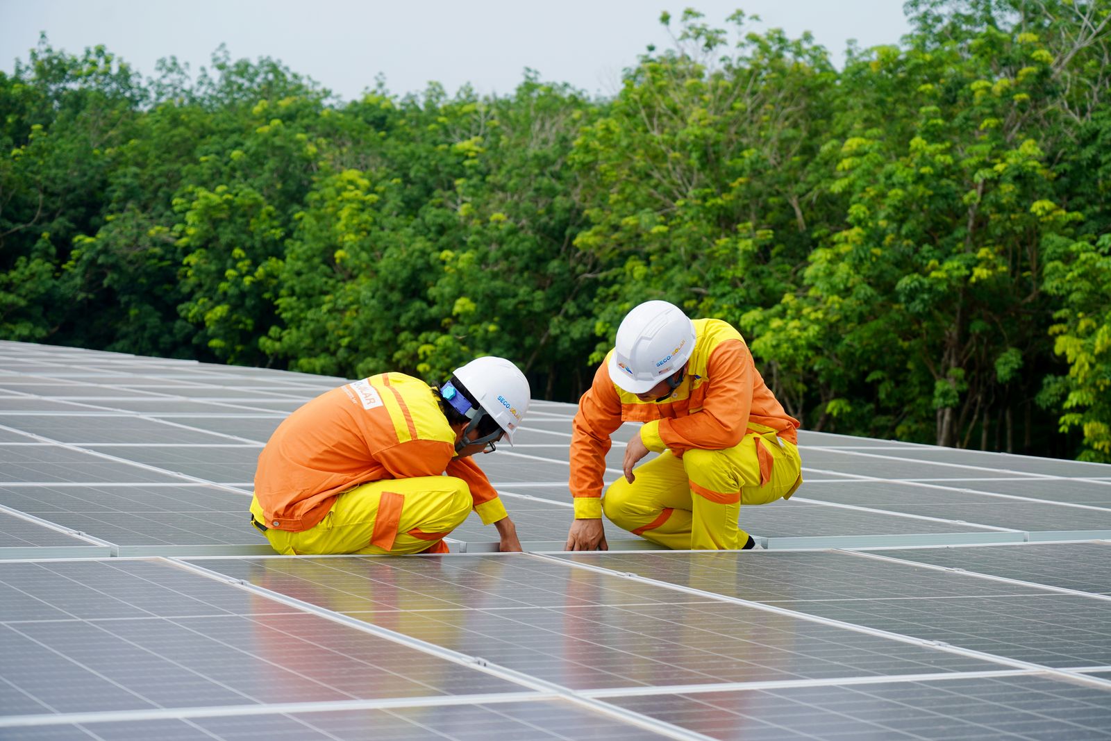 Crew reviewing a solar design on site